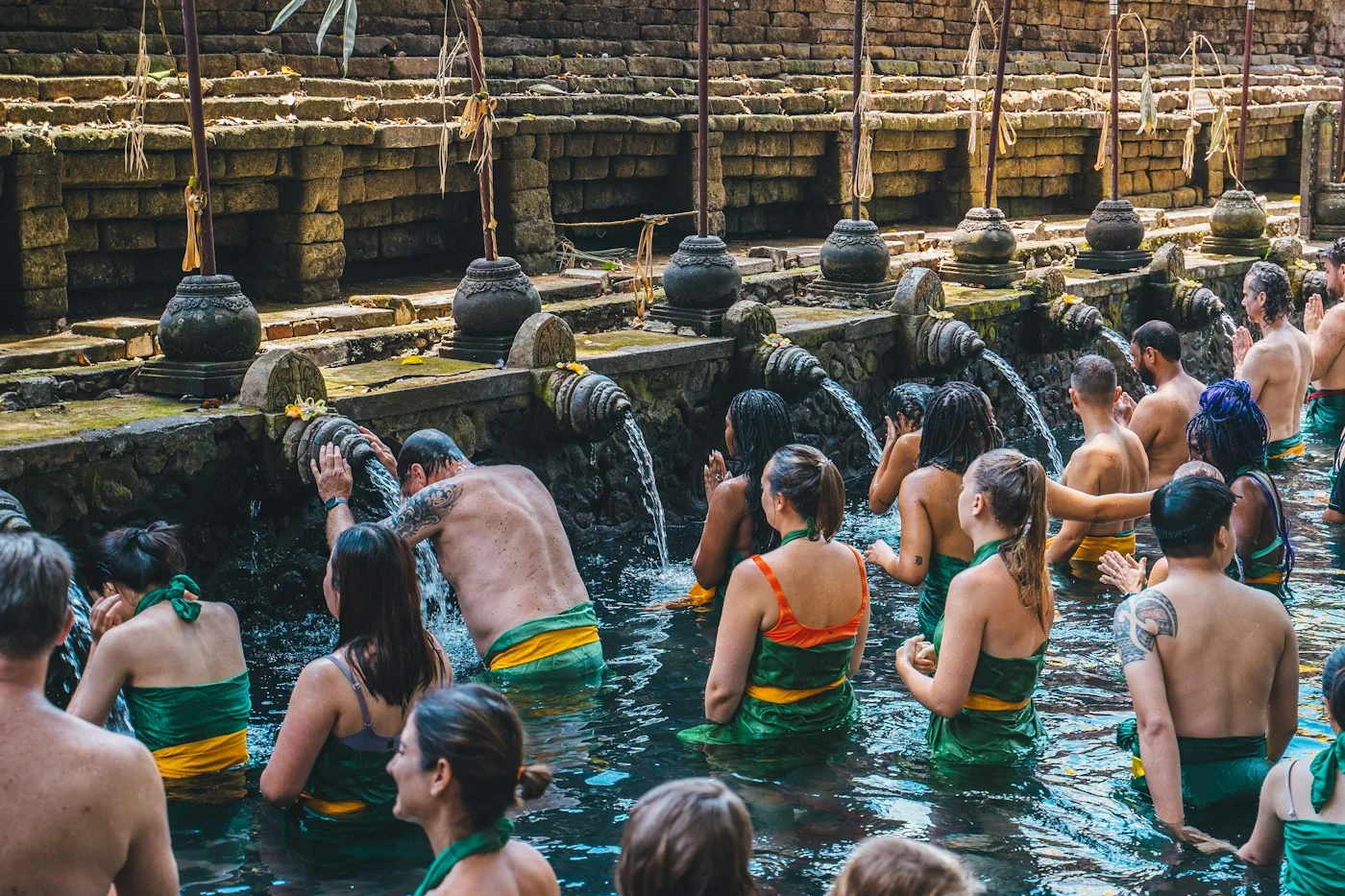 Sacred spring-water bathing area at Tirta Empul temple in Bali
